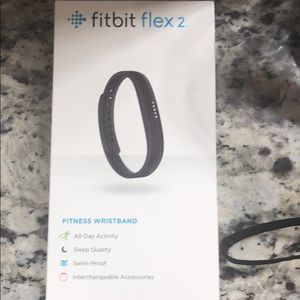 Fitbit tracker and silver bangle to go with it.